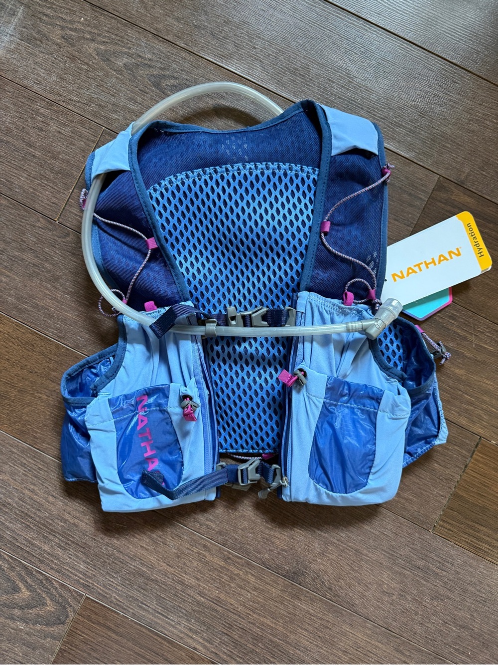 Natan Woman’s Hydration Vest in periwinkle and magenta Accents